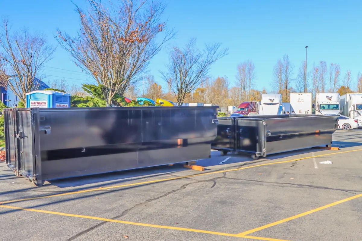 Professional dumpster rental service with roll-off container on residential driveway in Norway